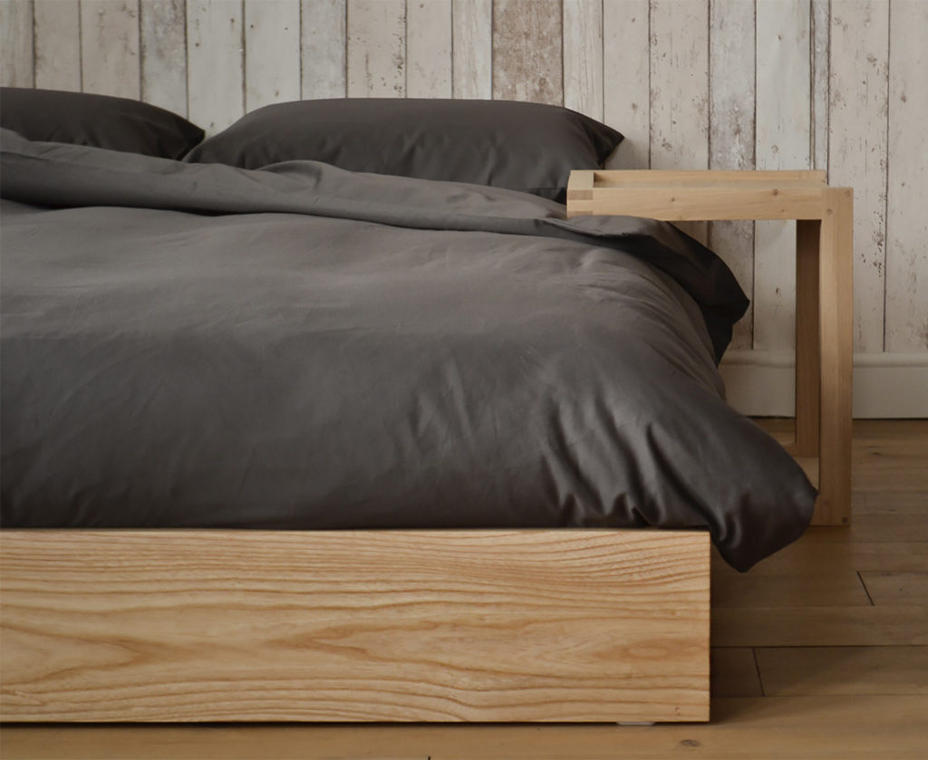 Ki ultra low wooden bed made from solid Ash & shown with Frame bedside table
