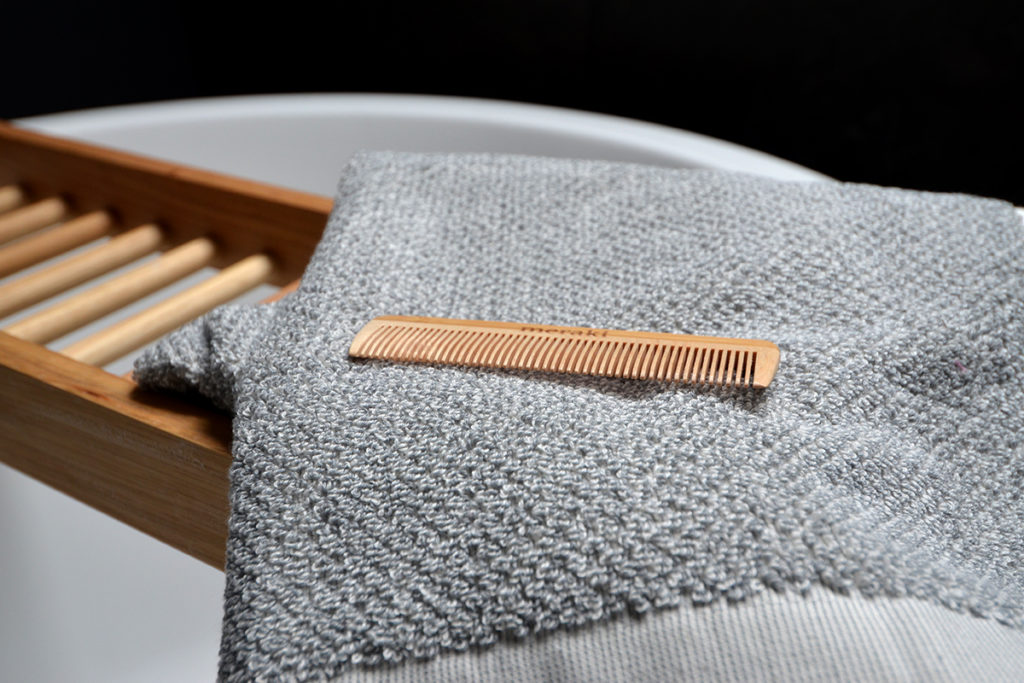 towel and comb on bathbridge