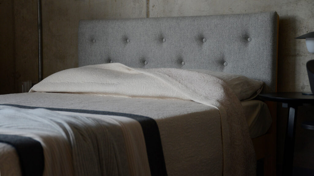 Arran parquet headboard with stone bedspread