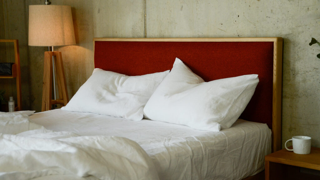 Carlisle Parquet Fire with Rumpled White Linen Pillows