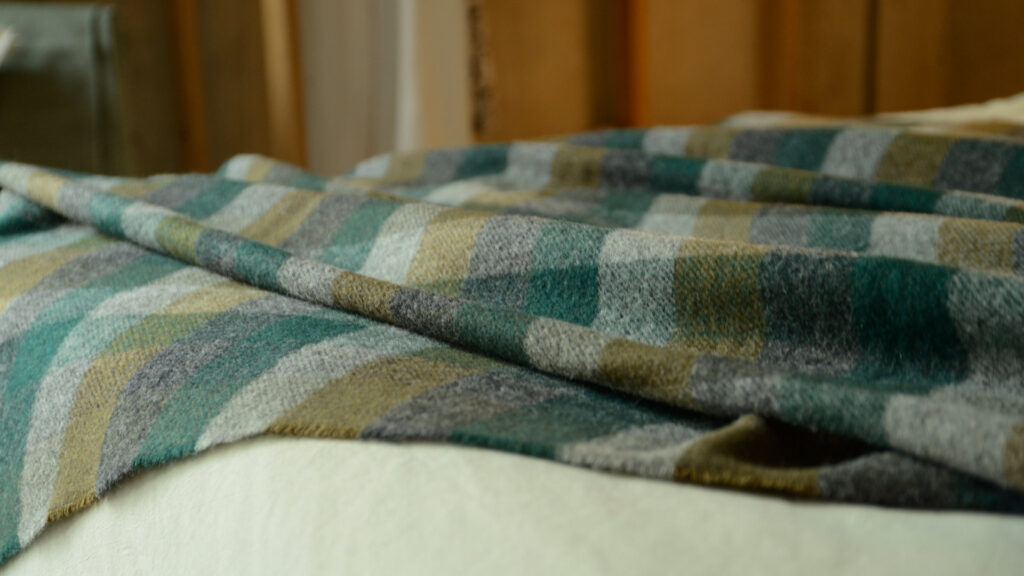 Forest Green Check Wool Throw over Stonewash Sage Bedding