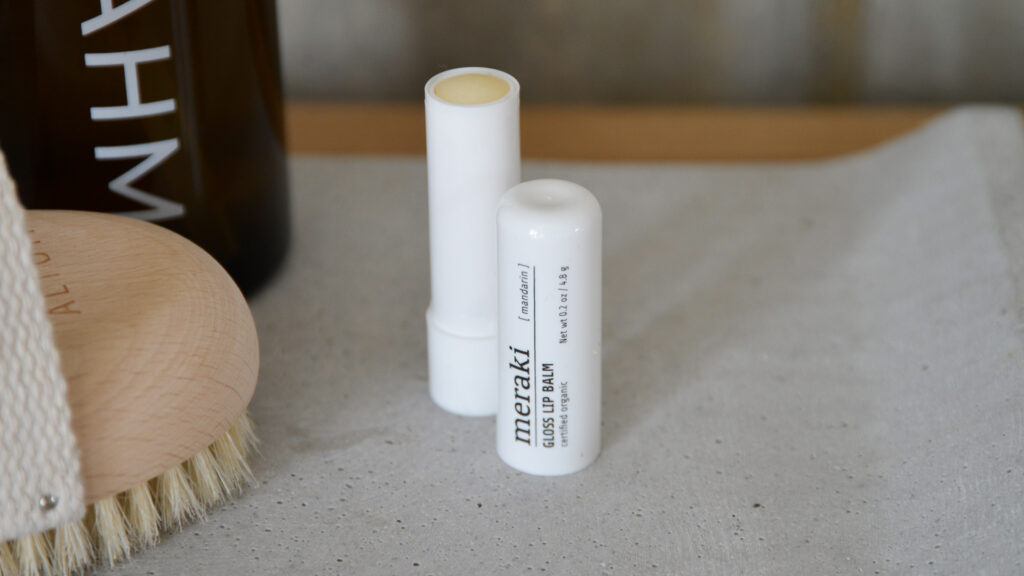 Meraki lip balm photographed with the lid off so you can see the product within.
