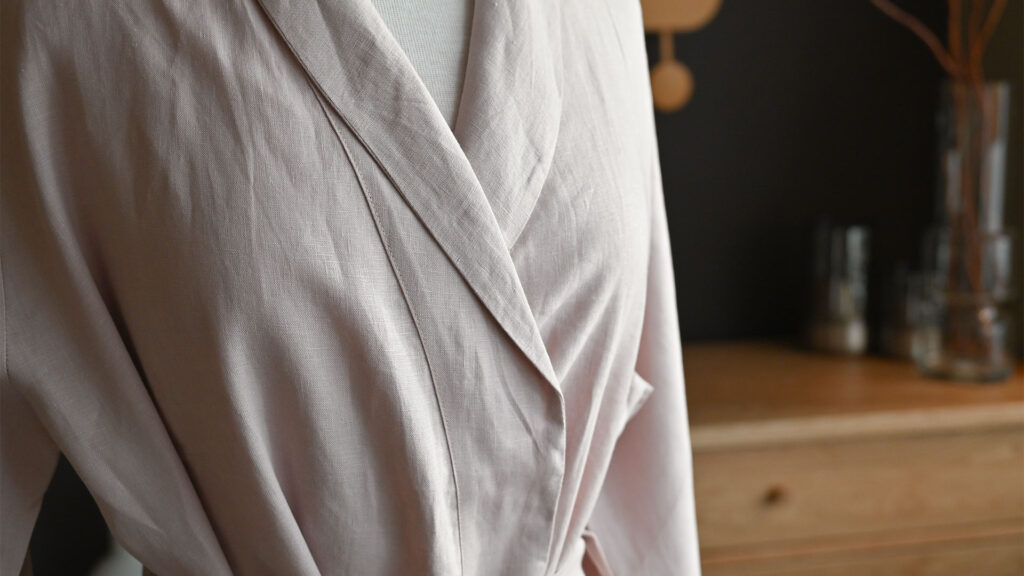 close up of lapel on pink linen robe.