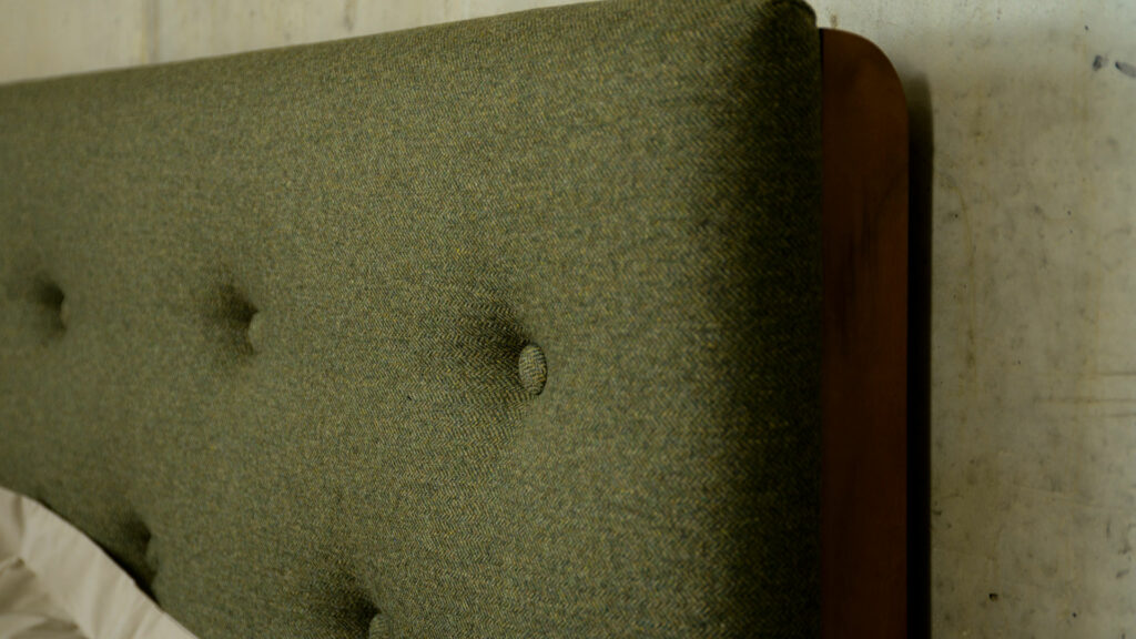 Poole Cyprus Green fabric upholstered headboard detail