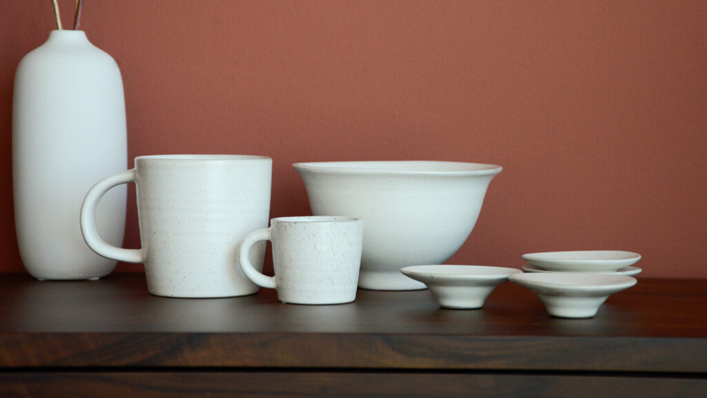 White stoneware mug, espresso cup, bowl and egg cups.