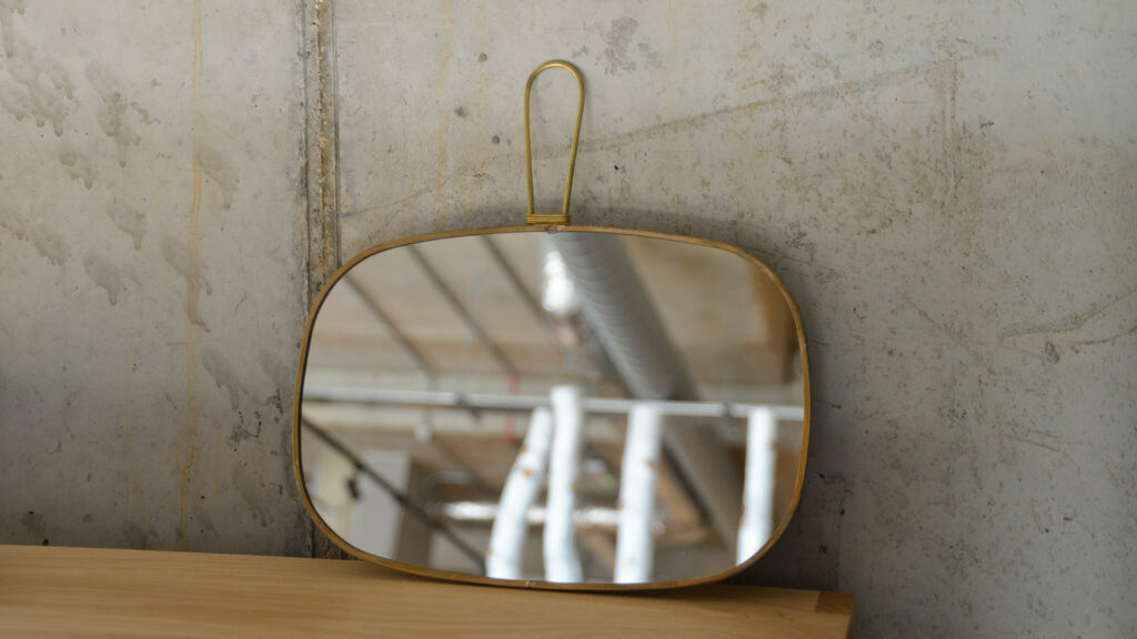 vintage look brass framed mirror to hang or hold