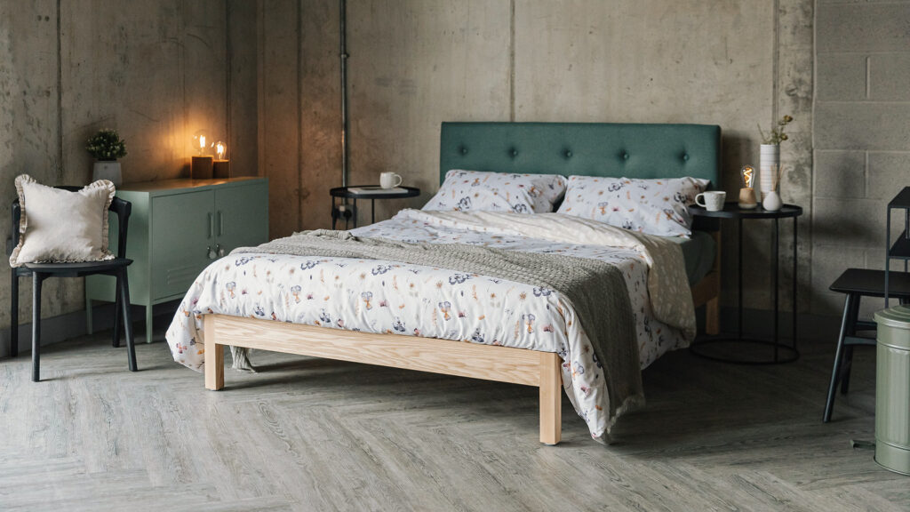 ash iona bed with seaglass colour headboard and wild flower bedding