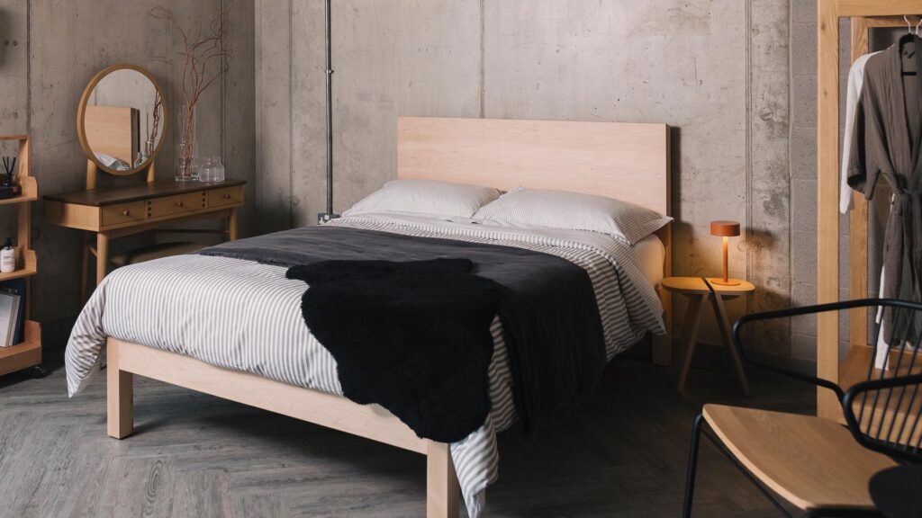 black and grey bedding on maple bed
