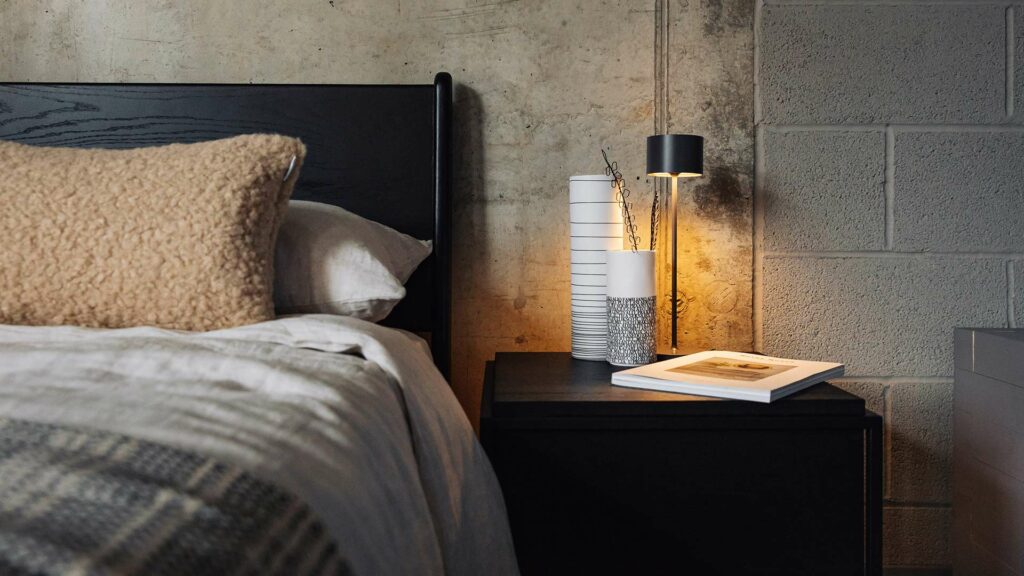 black camden bed faux sheepskin cushionwith LED light and vases 1