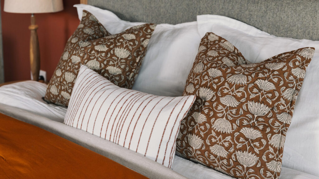 block print look cushions rust