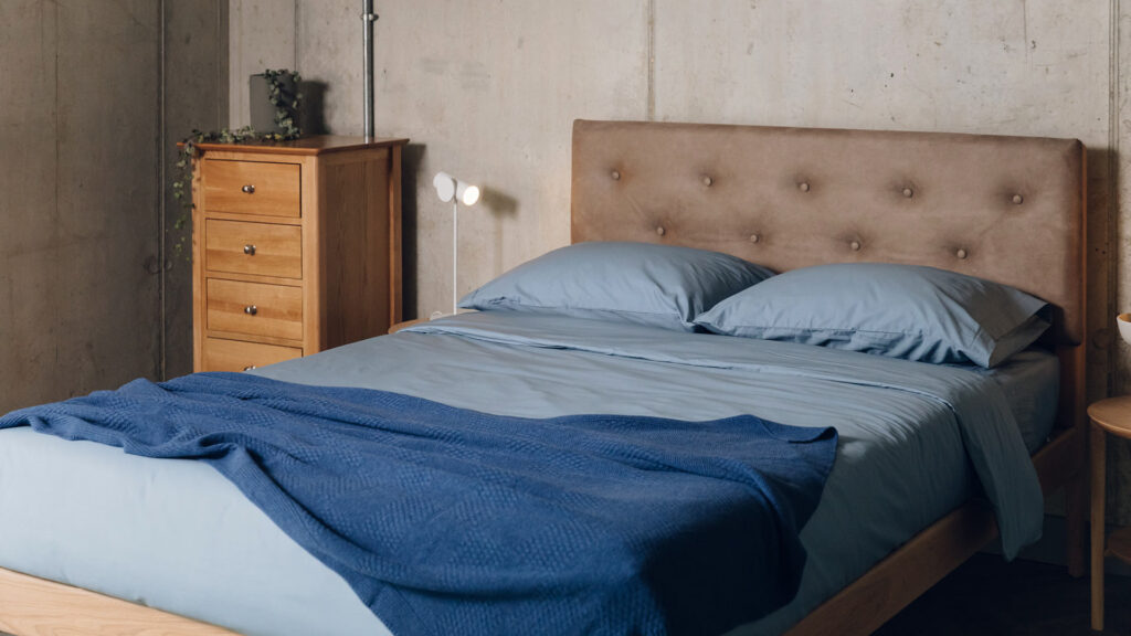 blue cotton bedding with deep blue cashmere throw