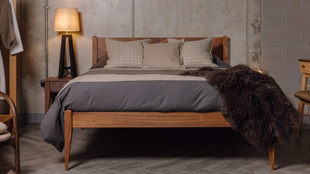 brushed cotton bedding and brown sheepskin on Dalston bed