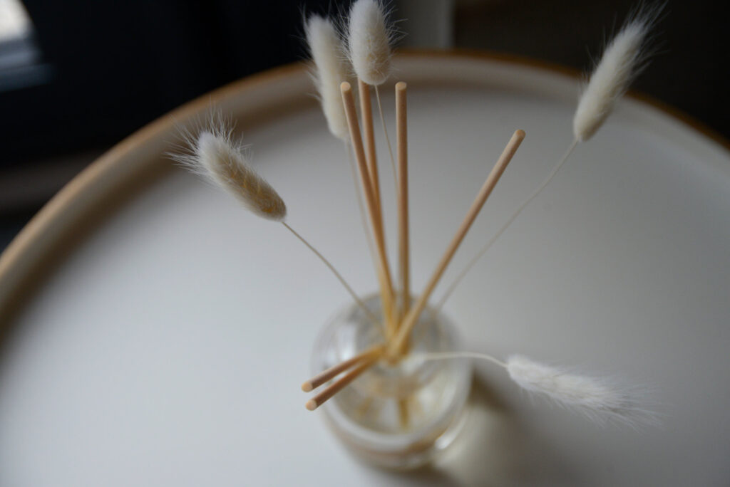 luxury glass room scent diffuser with reeds and bunny tails