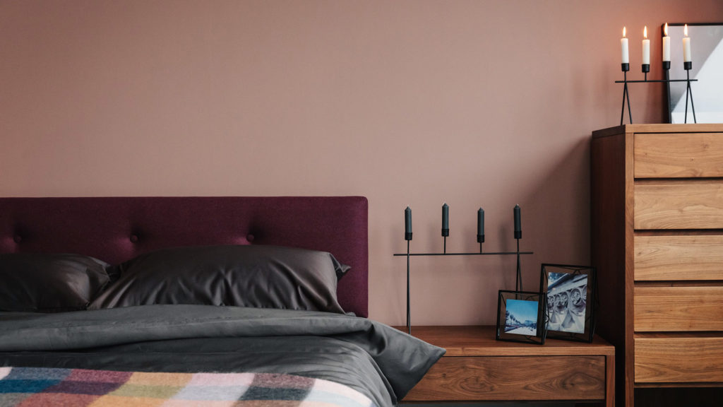 candle holders on walnut bedroom furniture with Iona bed