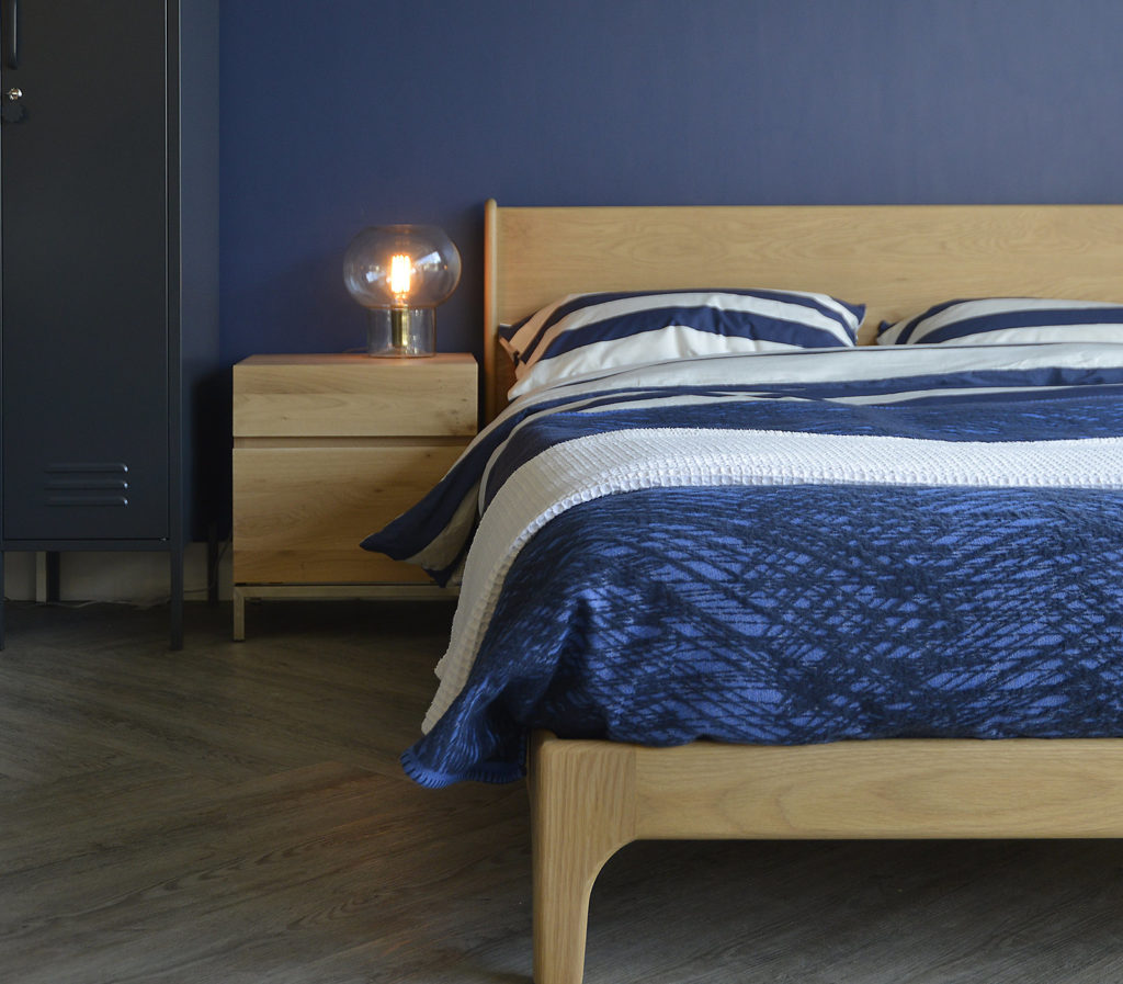A closer view of the low wooden Carnaby bed which comes in a choice of wood and a range of sizes.