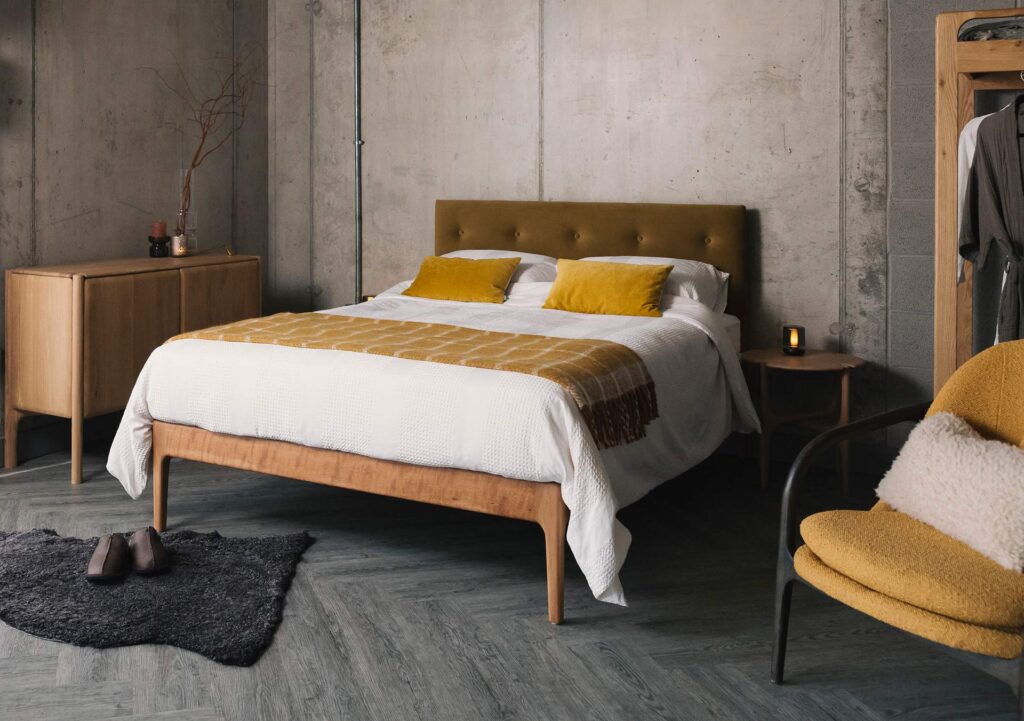 cherry bloomsbury bed with eco velvet upholstery and white and yellow bedding 1350