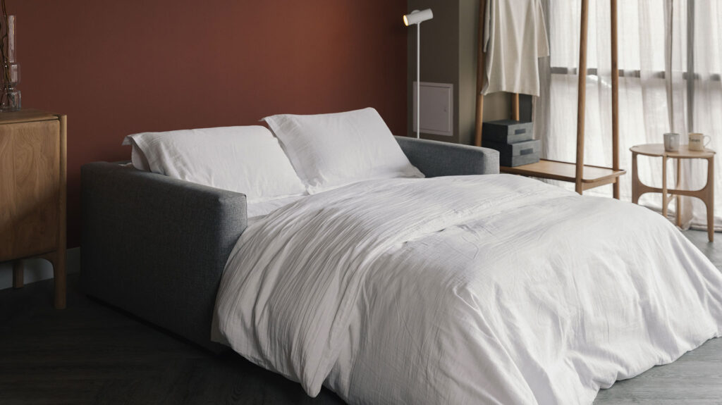 compact sofa bed made up as a bed