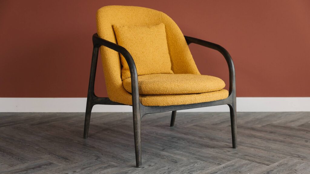 dark wood bedroom chair with mustard upholstery 