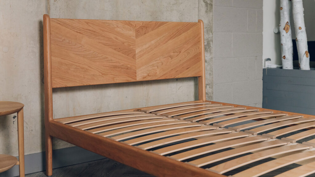 double size cherry wood Hoxton bed shown without mattress
