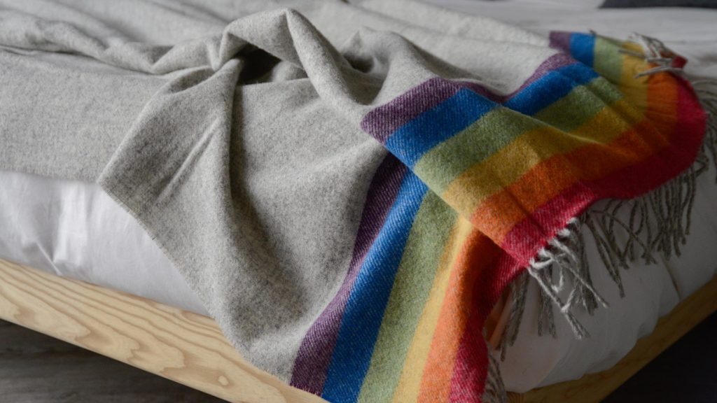 grey and multicolour throw