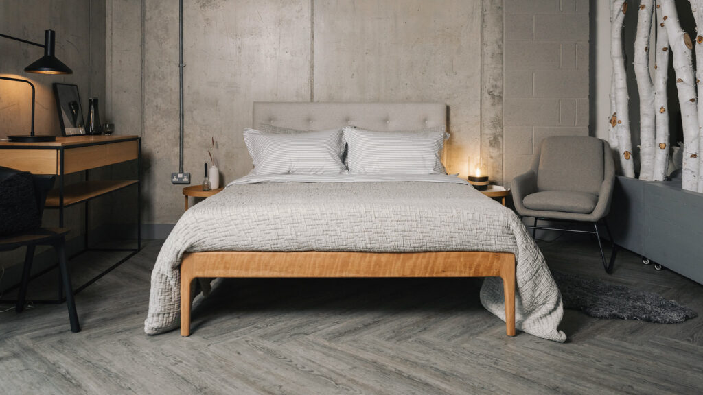 grey bedroom scheme with a cherry wood Bloomsbury bed with grey wool headboard