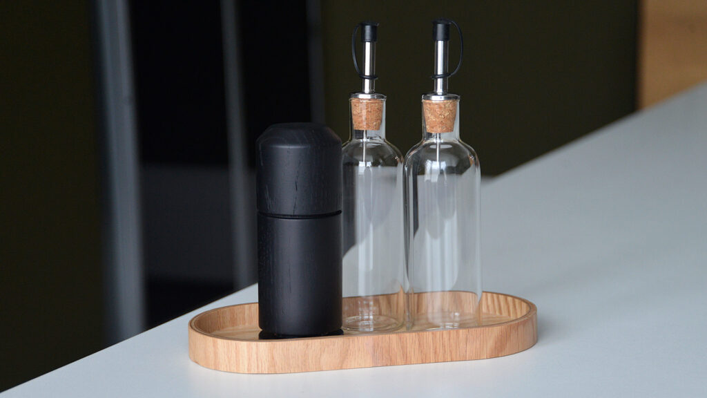 grinder tray and glass oil and vinegar bottles