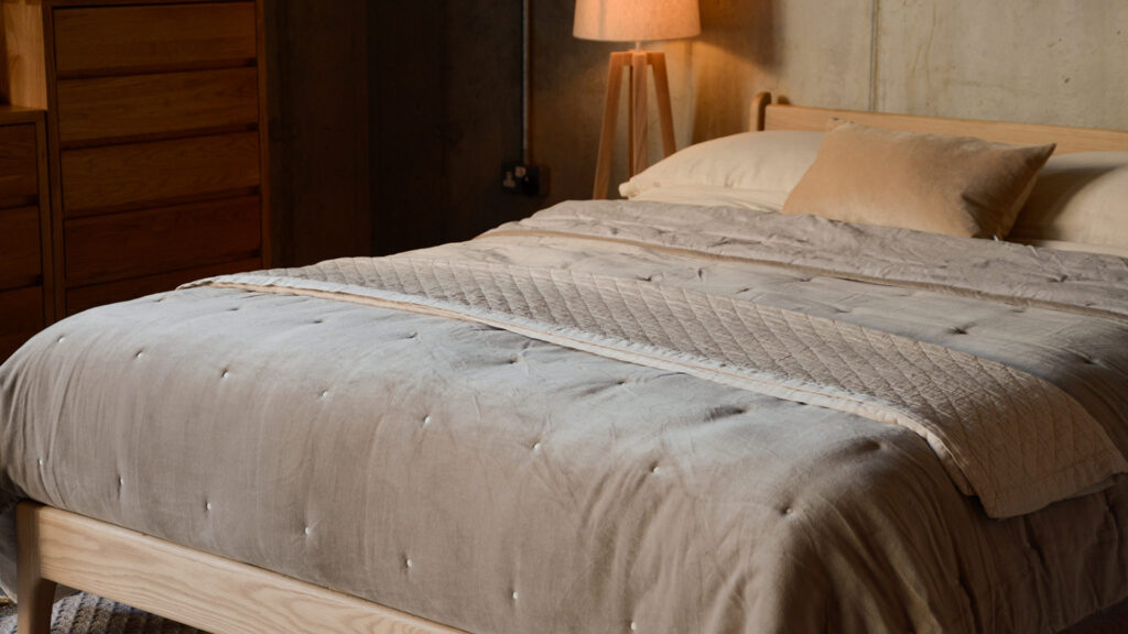 hazelnut velvet bedspread and deep cream throw