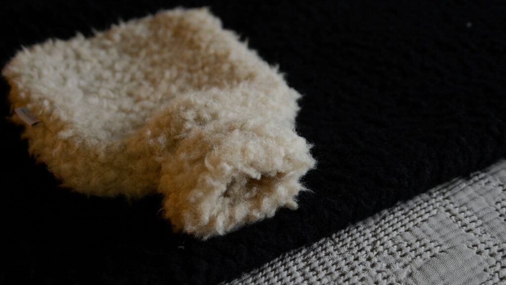 hot water bottle with fluffy faux sheepskin cover