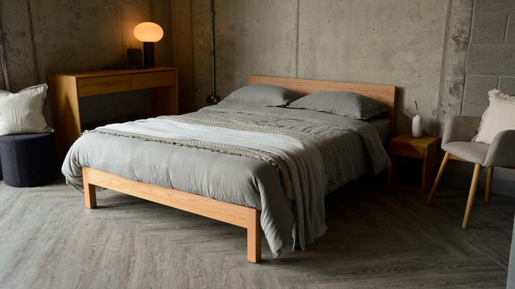 Contemporary king size cherry wood Sahara bed shown with grey bedding