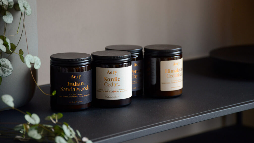 luxury scented candles in small travel jars