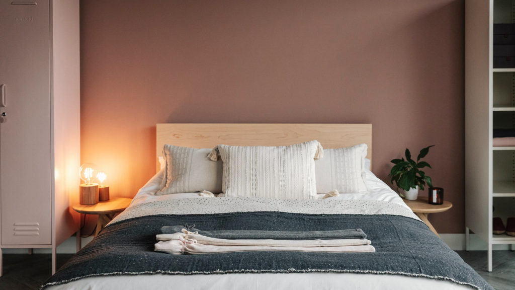 maple Malabar bed with ivory bedding and cosy CHALK hotwater bottles