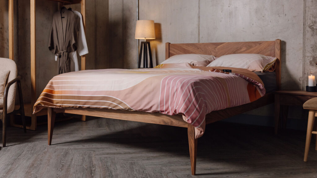 modern printed bedding on Dalston walnut bed