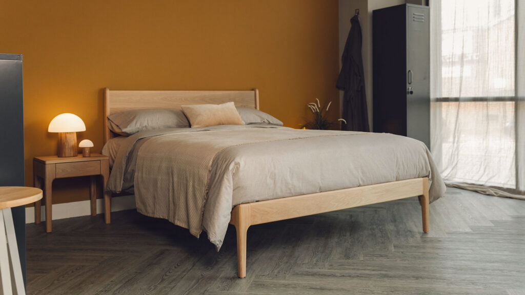 oak camden bed with tawny organic cotton bedding and dark grey lockers.
