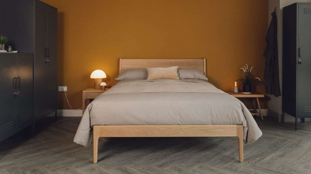 oak camden bed with tawny organic cotton bedding and dark grey lockers.