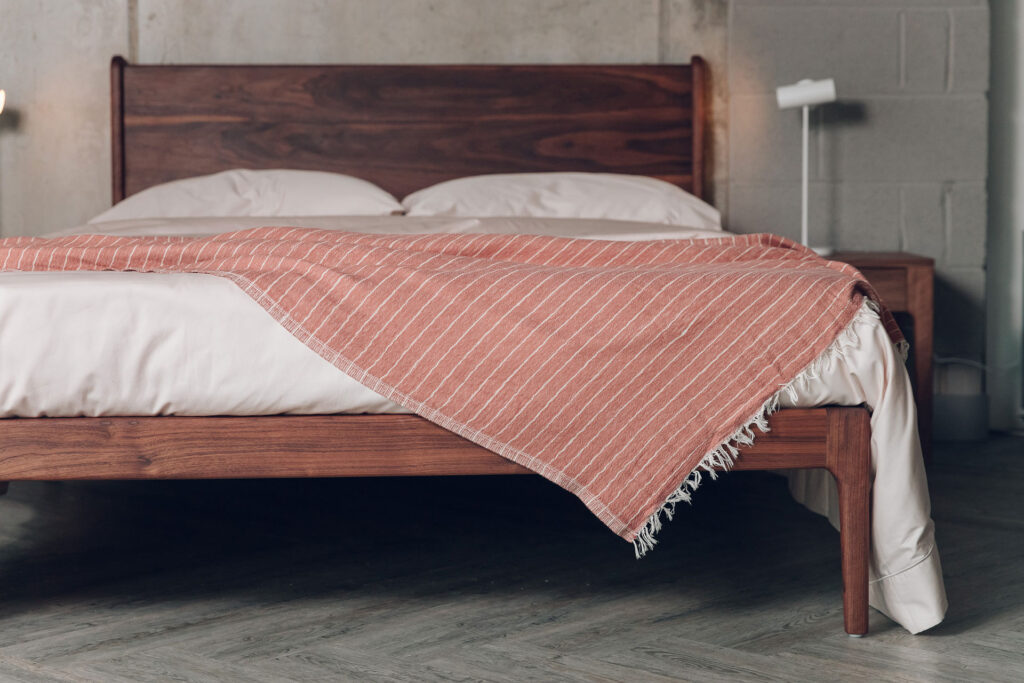 oiled walnut camden with rust colour striped throw