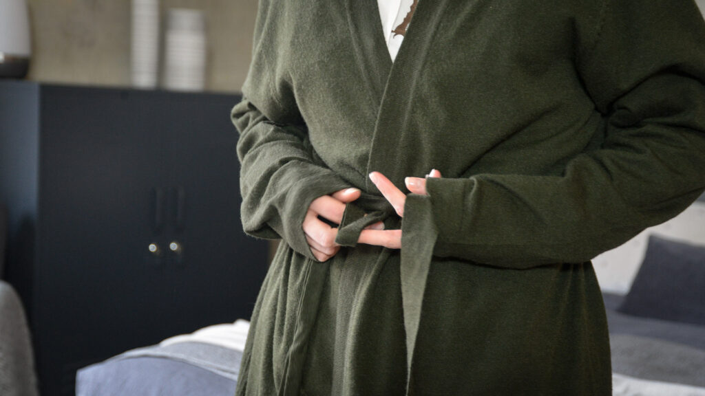 a closer view of the olive green knitted robe