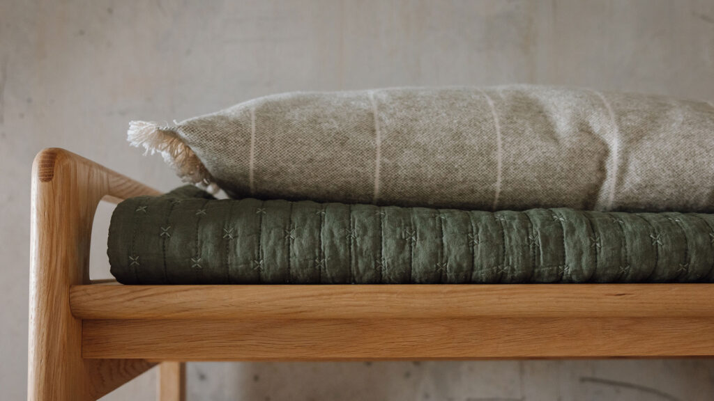 olive quilt and sage green cushion
