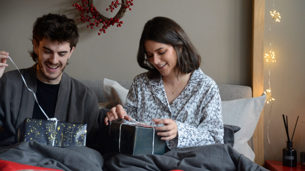 opening christmas gifts grey pjs