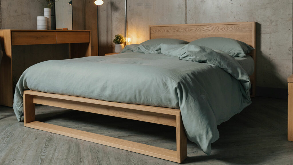 sage green organic linen bedding on solid oak contemporary bed 1