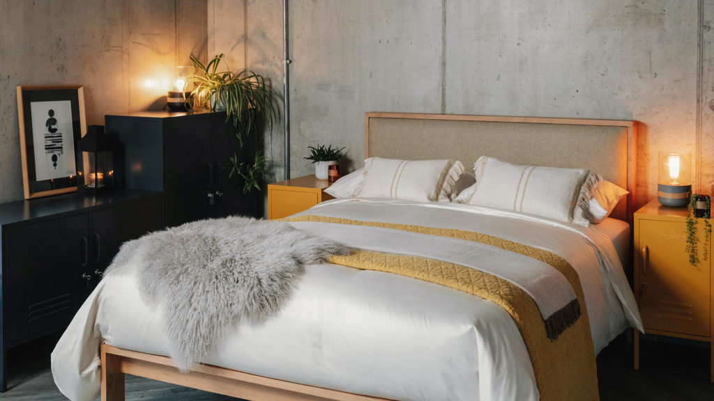 shetland bed with sateen bedding andas cushions and honeycomb bedspread