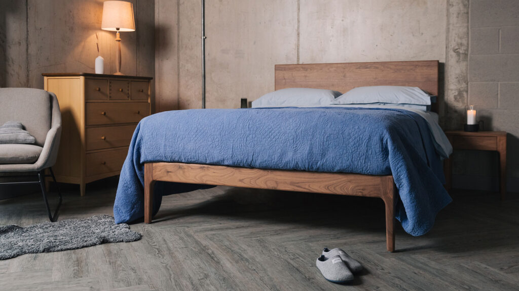 solid walnut bed chiswick design with blue bedding