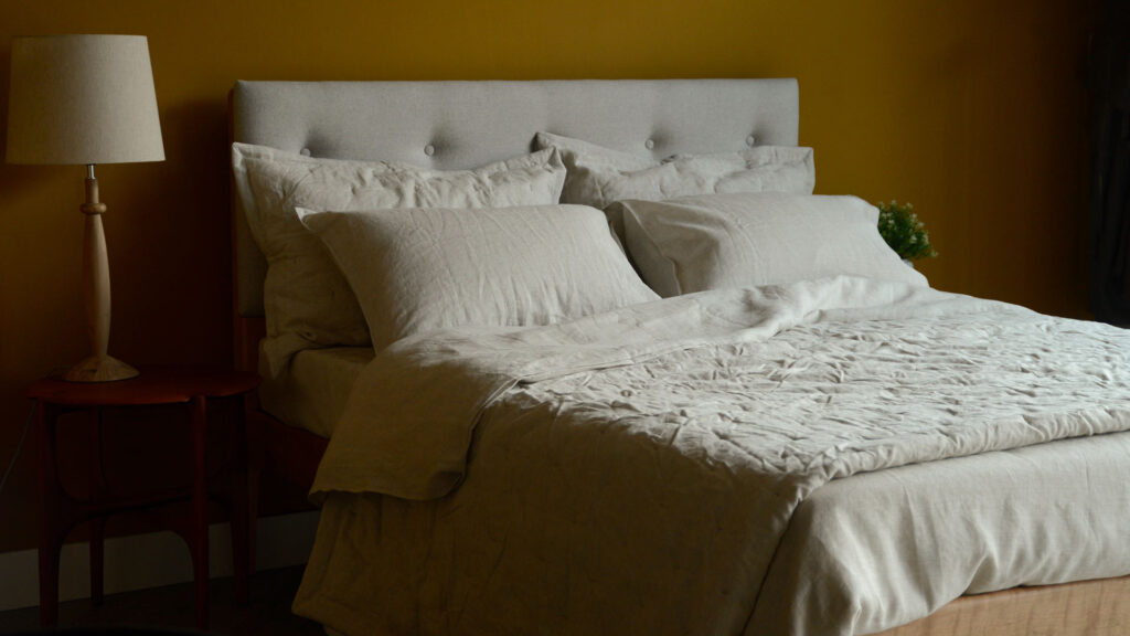 stone marl coloured linen bedding including duvet cover and pillowcases shown on a kingsize bed