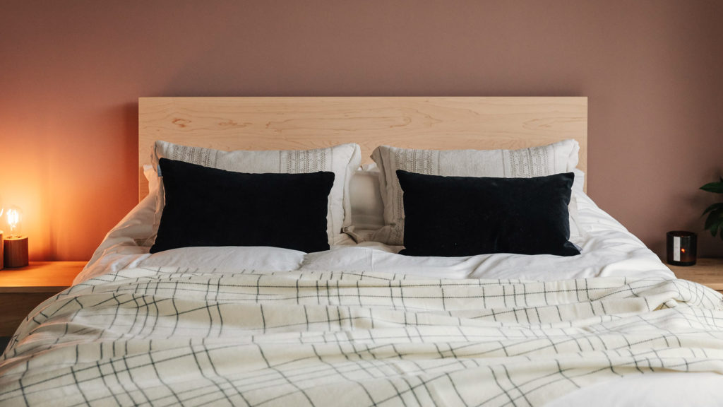 triple windowpane patterned merino throw on Malabar bed