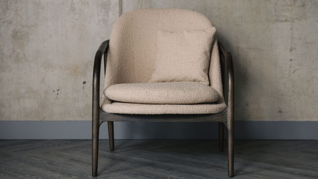 upholstered chair with curved wooden frame