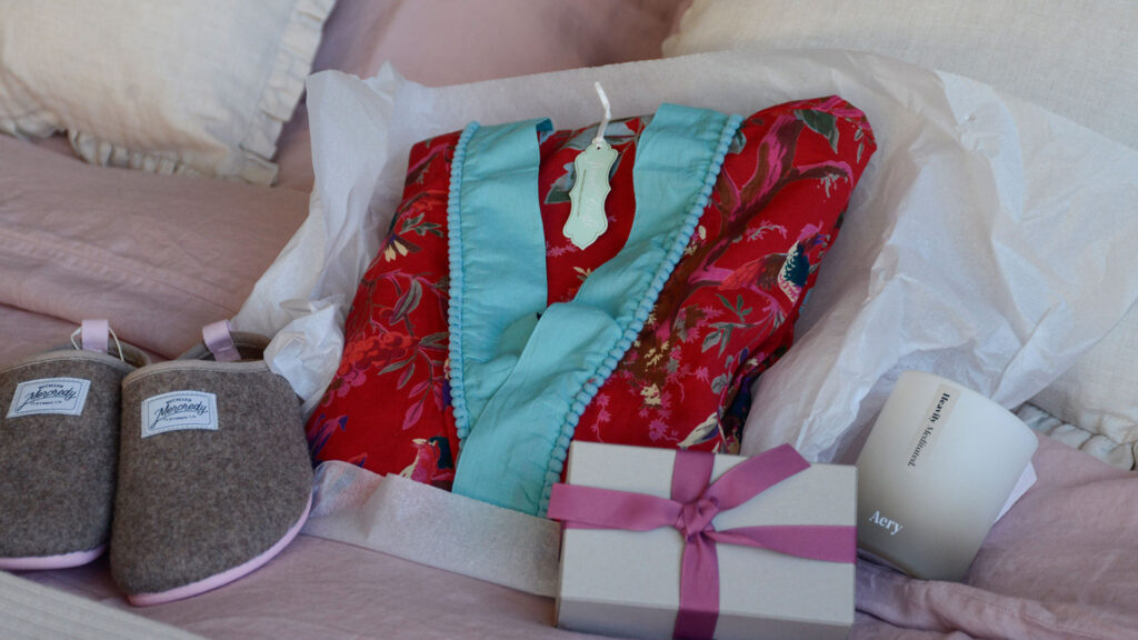 valentines day red floral robe with sustainable slippers and aery candle