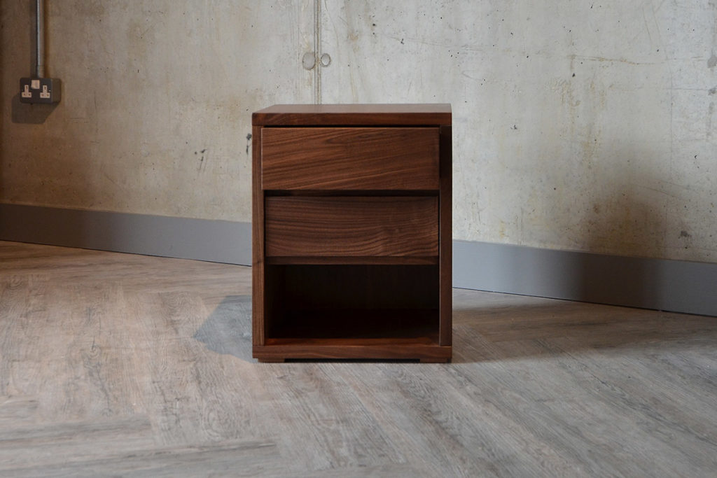 Black Lotus Cube bedside table in Walnut, with 2 drawers and storage shelf. Exclusive to NBC.