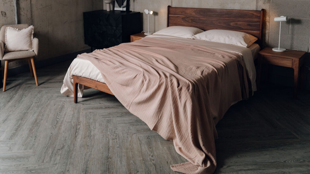 walnut camden bed with rose muslin bedspread.