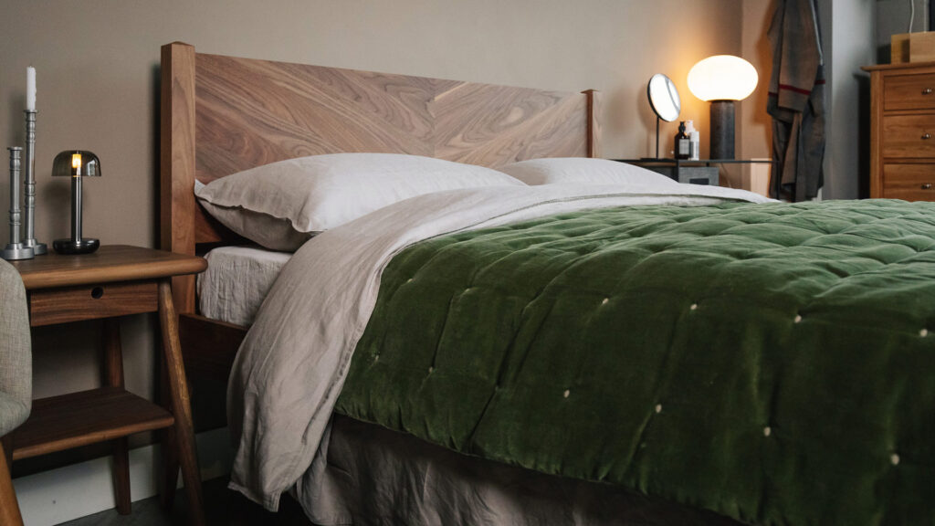 walnut dalston bed with olive velvet throw