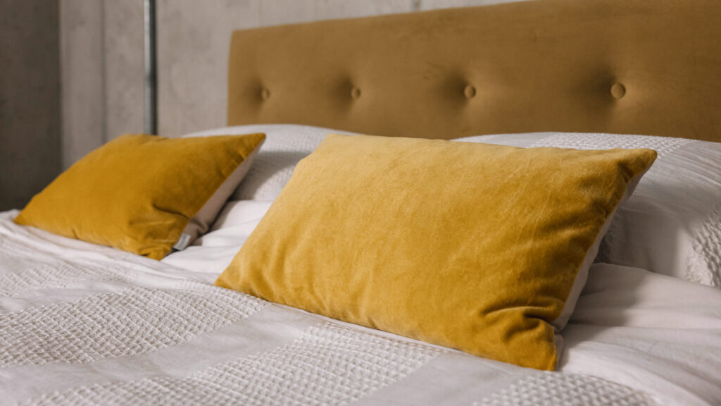 white waffle stripe duvet set detail with yellow velvet cushions
