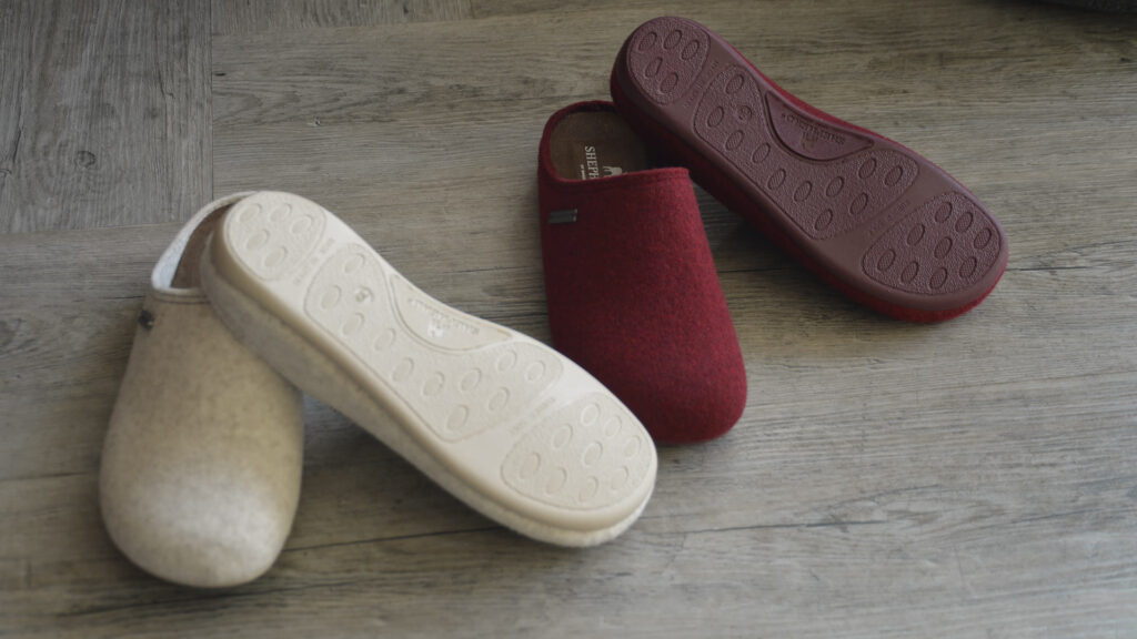 red and white woollen slippers with rubber sole.